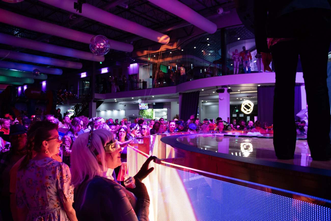 Packed crowd at the LED bar with the mezzanine above