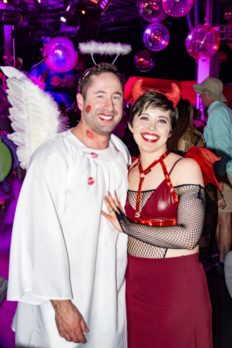 Angel and devil under the disco balls, lipstick kisses still drying at Coloween — Denver Halloween nightlife