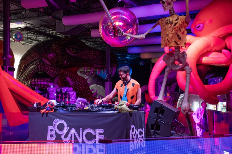 T-rex, skeleton, and octopus flank the DJ booth