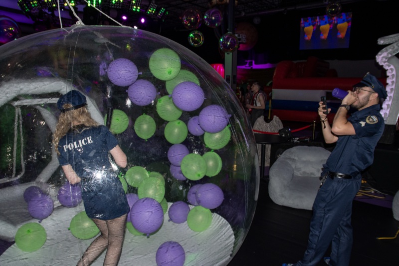One cop, one bubble dome, several hundred balloons