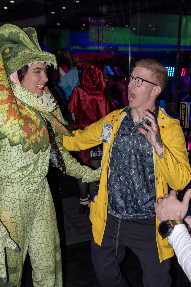 A dilophosaurus tests the Jurassic Park guy's nerve at Coloween — Denver Halloween nightlife